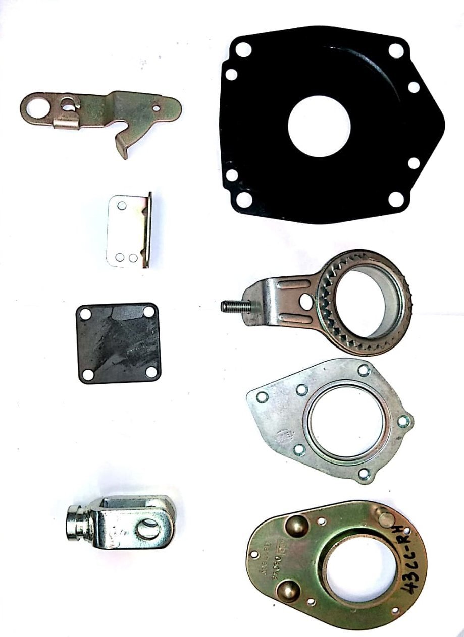 Assorted pressed components including cover plates, forks and brackets